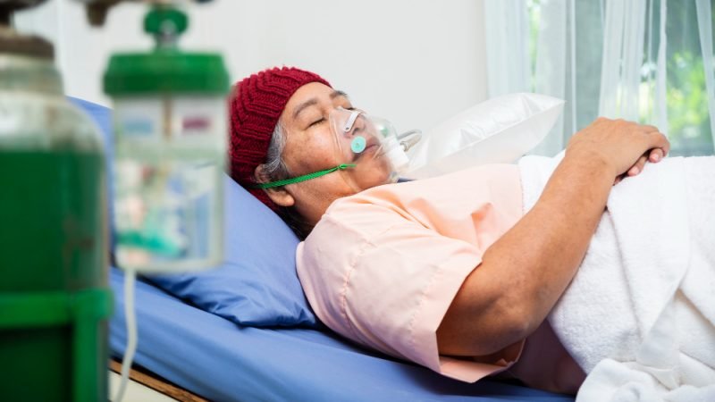 Older patient receiving oxygen therapy at Pacific Hyperbarics — Madras